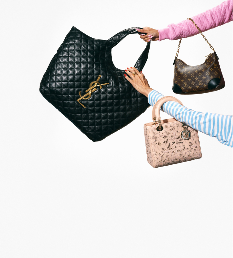 Arms outreached holding luxury handbags on light gray background