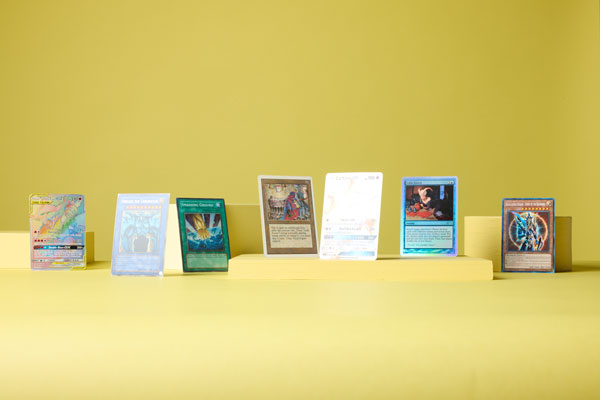 Multiple trading cards with yellow background