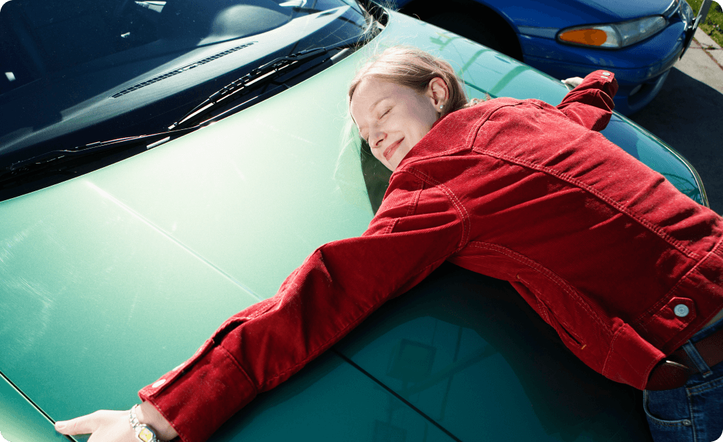 woman and a green car