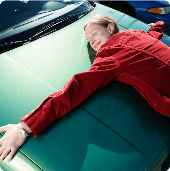 woman and a green car