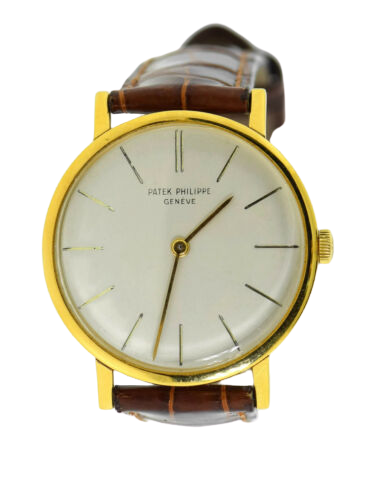 A vintage leather strap Patek Philippe watch with gold accents.