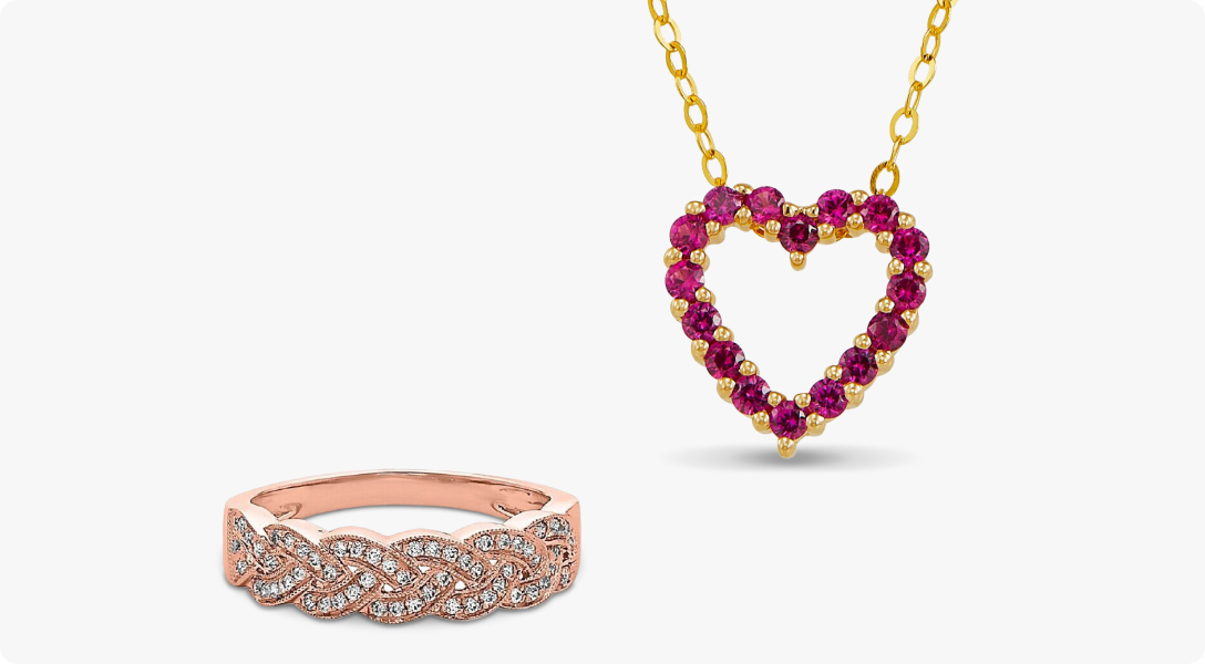 A rose gold ring accented by a diamond pattern to the left of a gold necklace with a ruby heart pendant.