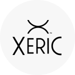 The Xeric logo, which is the brand name in black text. Above it are two lines: one convex U-shaped arc above a concave arc, their vertices touching.