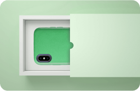 Ein grünes Smartphone in seiner Verpackung.