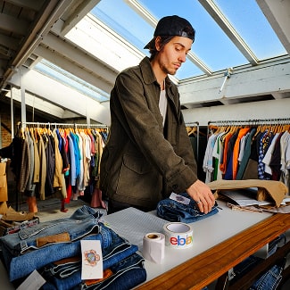 Picture of a man folding jeans