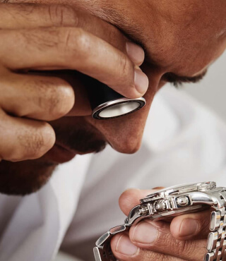 A man authenticates a watch