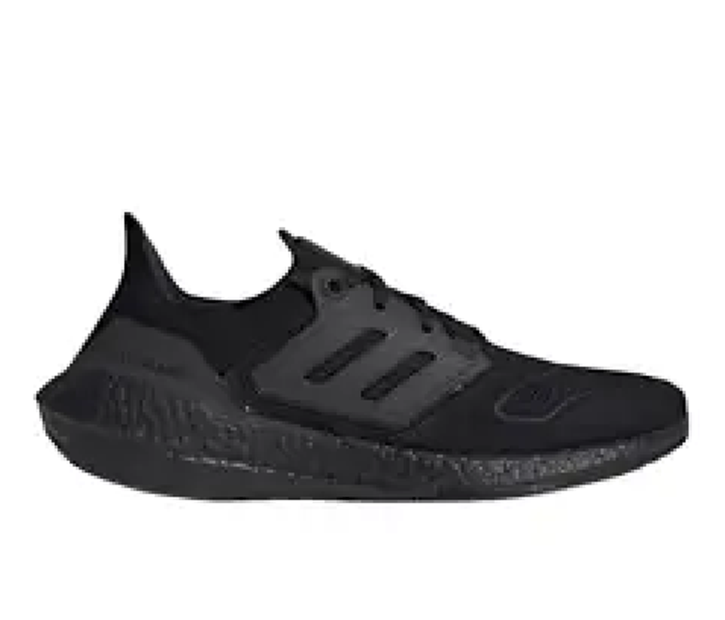 Side view of a black adidas sneaker with a thick, cushioned sole and matte black detailing around the laces.