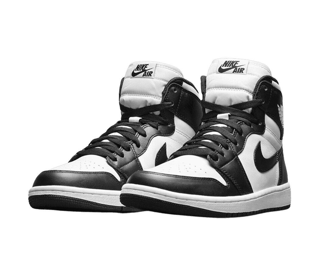 A pair of AJ1 High sneakers in white uppers and midsoles, with black laces, overlays, and outsoles.