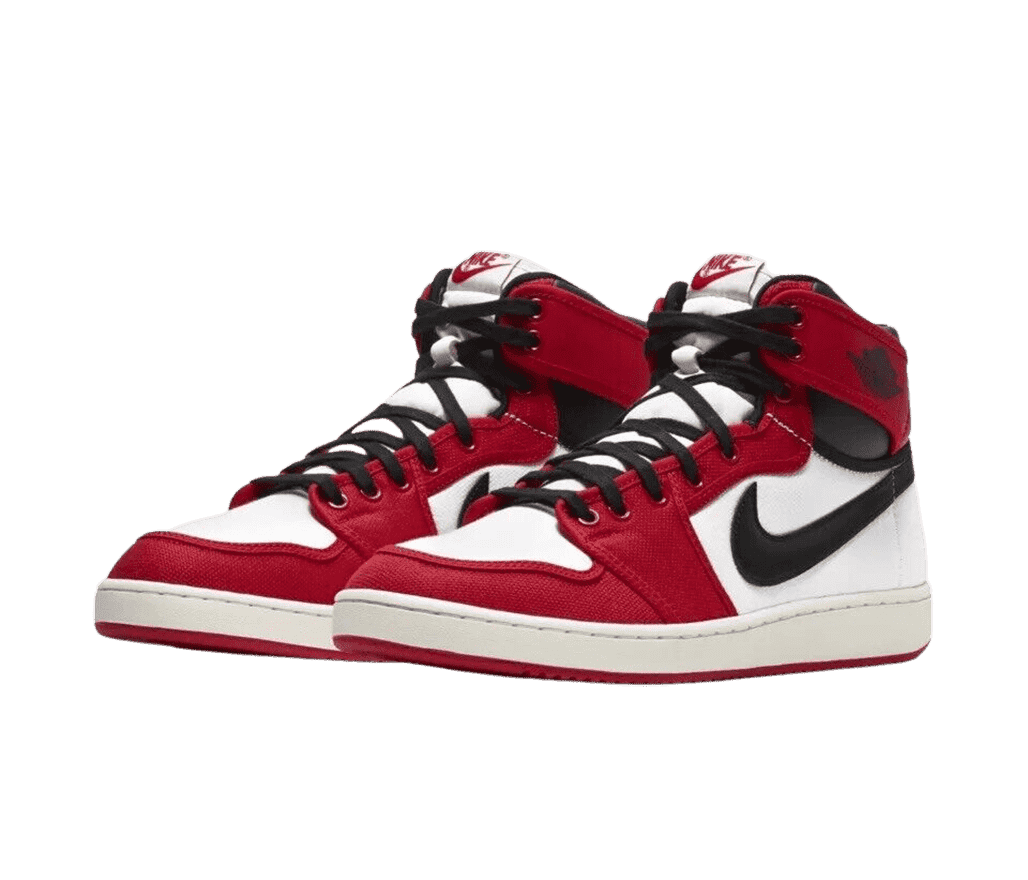 A pair of Jordan 1 AJKO sneakers in red and canvas, black laces, Swooshes, and collars, and off-white midsoles.