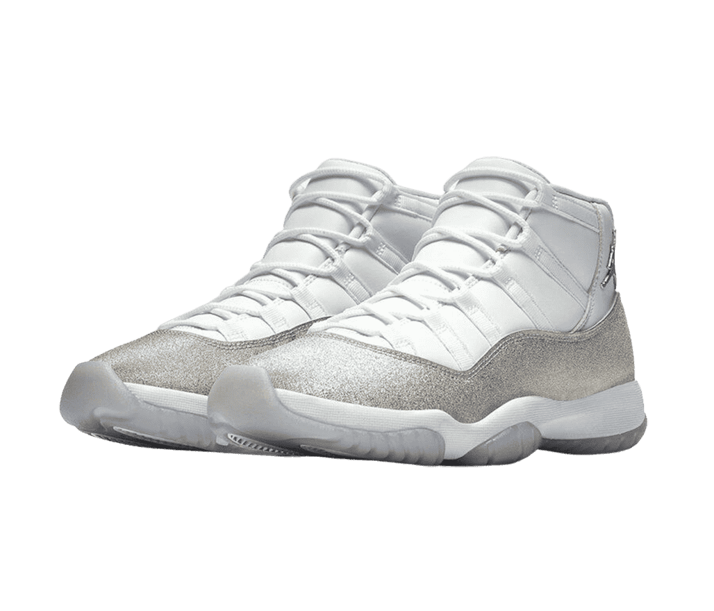 A white pair of AJ11 “Vast Grey” High sneakers with light gray semi-translucent outsoles and a shimmering metallic silver overlay.