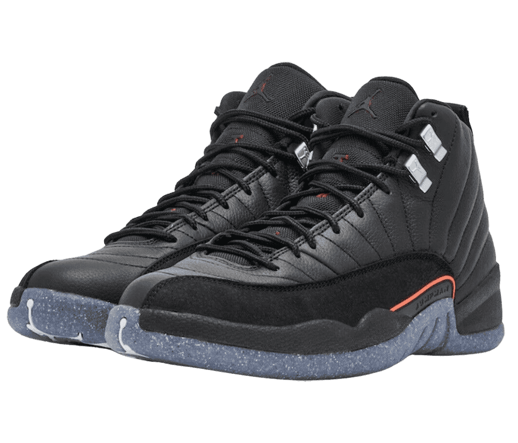An all-black leather pair of AJ12 “Utility” sneakers with suede mudguards, speckled navy soles, a red accent on the lateral side, and gray lace locks.