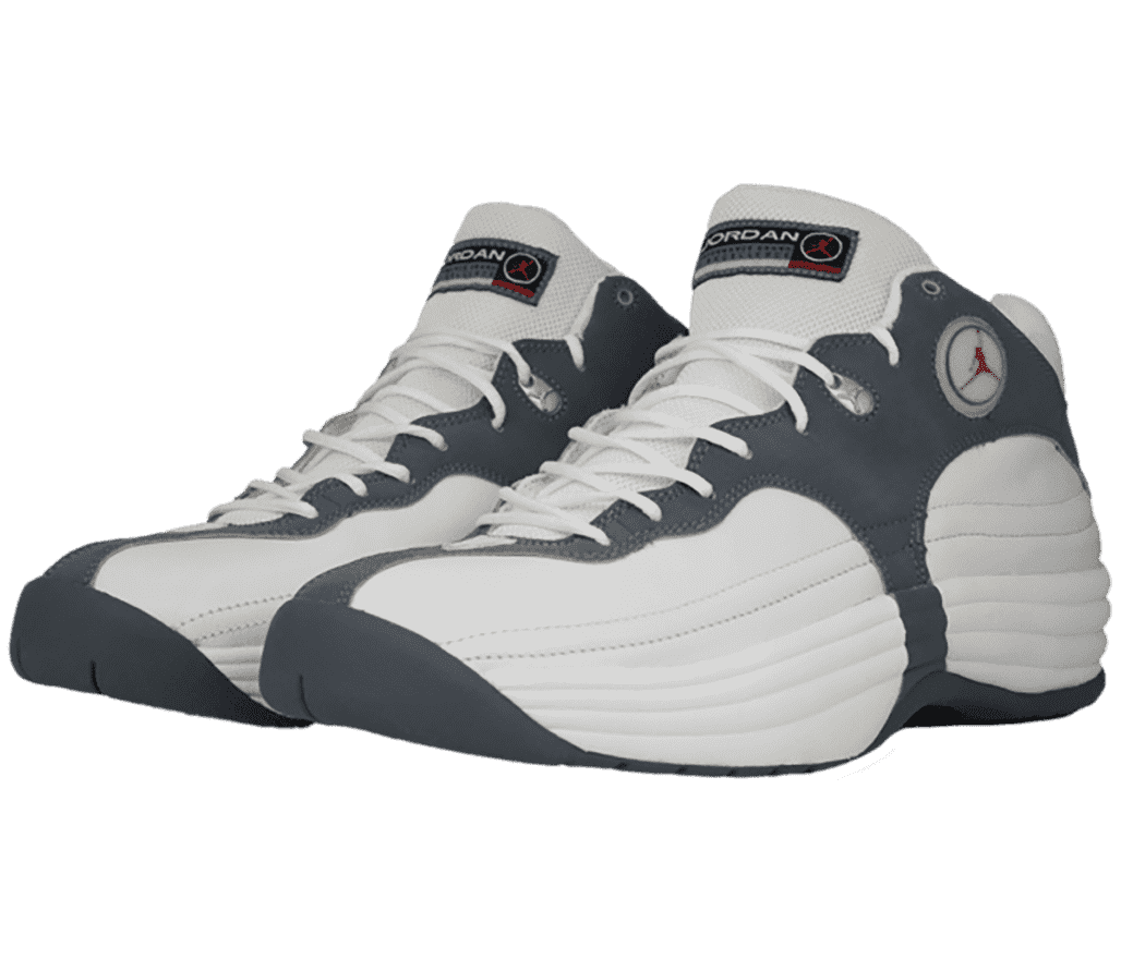 A pair of Jordan Jumpman Team 1 sneakers in white and gray suede with a very round look and horizontal stitching along the sides.