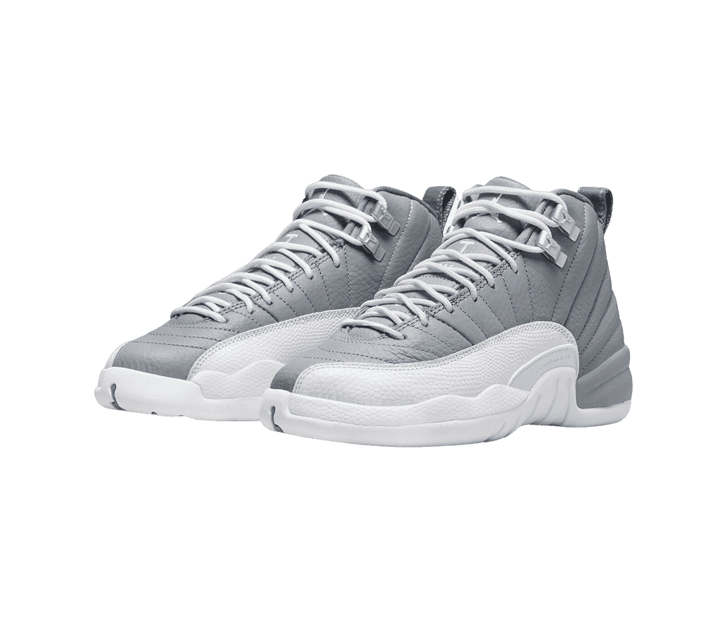 A pair of AJ12 “Stealth” sneakers with gray uppers and white laces, soles, and mudguards.