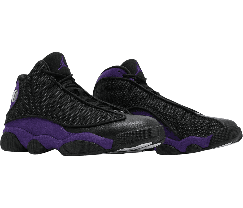 A pair of AJ13 sneakers with black uppers, black and white soles, and dark purple midsoles.