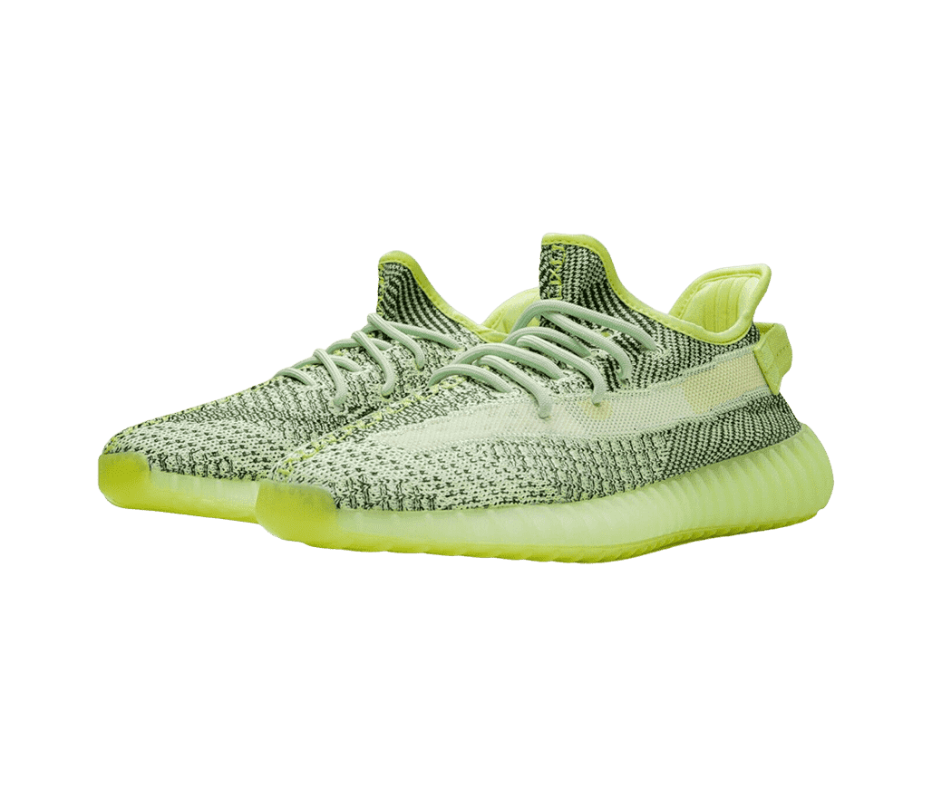 A pair of Adidas Yeezy Boost 350 “YEEZREEL” sneakers in a dull lime green with black marled uppers.
