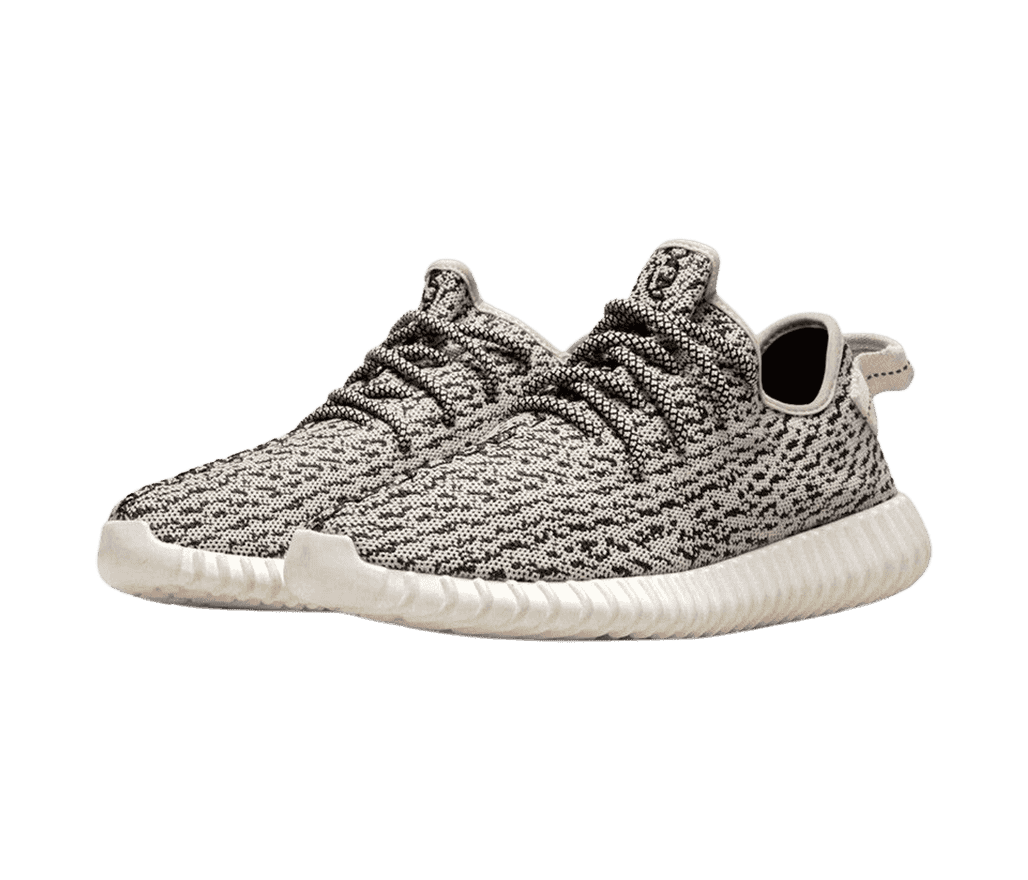 A pair of Adidas Yeezy Boost 350 sneakers with white soles and intricate woven uppers in gray and black.