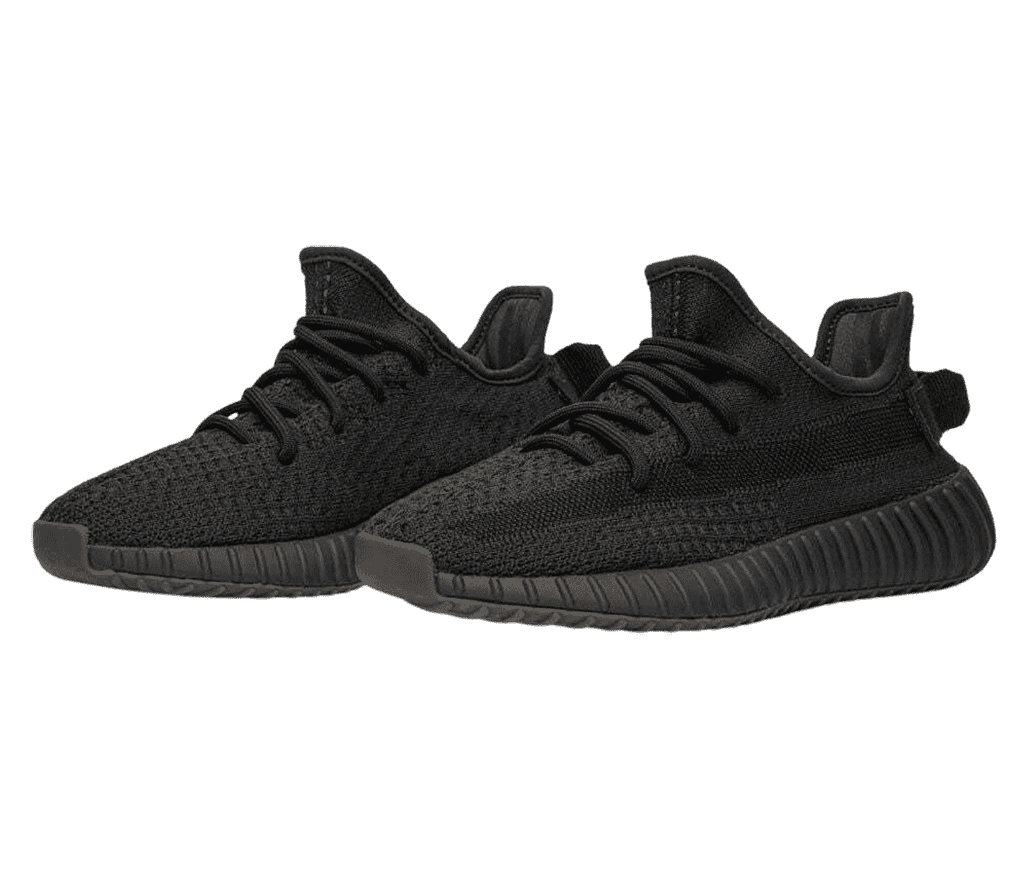 An all-black pair of Adidas YEEZY Boost 350 sneakers with woven uppers and vertically ribbed soles.