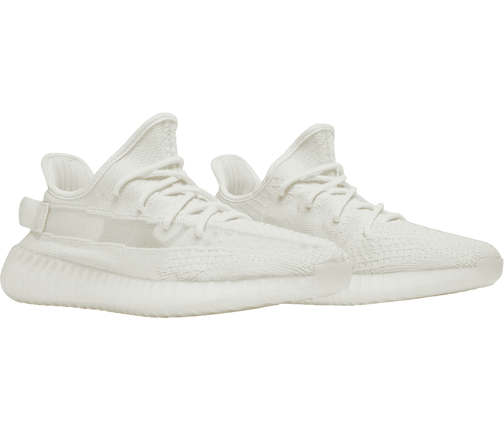 An all-white pair of Adidas YEEZY Boost 350 “Bone” sneakers with woven uppers and vertically ribbed soles.