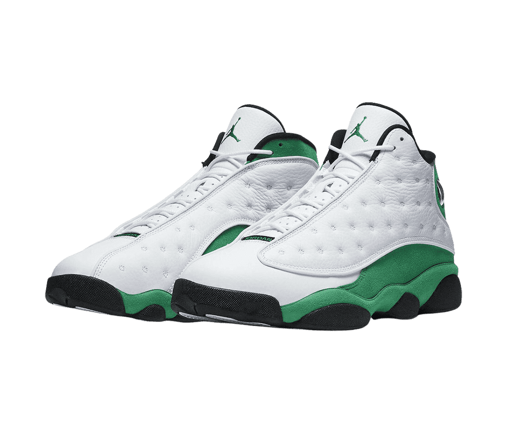 A pair of AJ13 sneakers with white uppers, black outsoles, and green suede quarters.