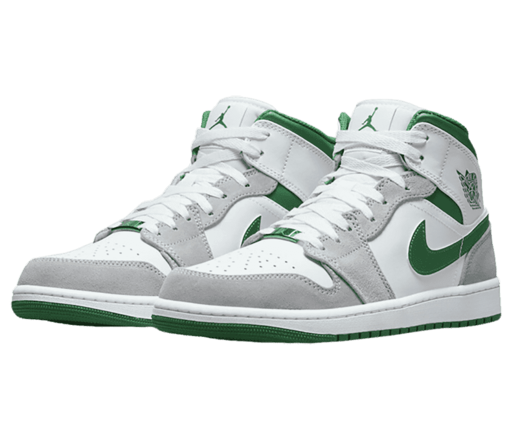 A white pair of AJ1 Mid sneakers with gray suede overlays and green Swooshes, collars, and outsoles.