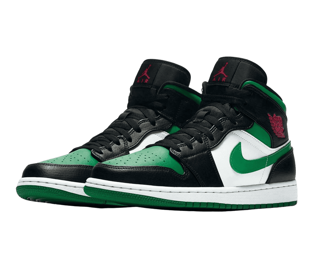 A pair of AJ1 Mid sneakers in black, green, and white with red logos on the collars and tongues.