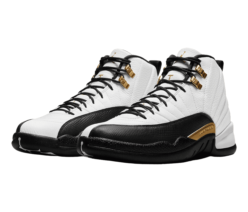 A white pair of AJ12 “Royalty” sneakers with black soles and mudguards and gold accents.