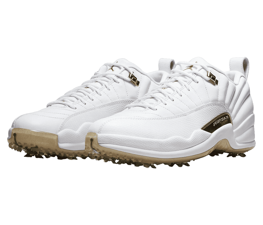 A white pair of AJ12 Low sneakers with gold accents, outsoles, and golf cleats.