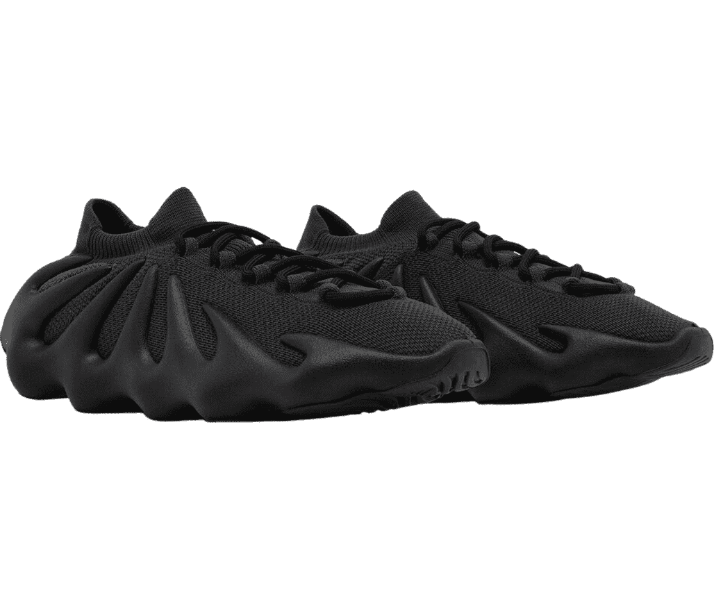 A pair of YEEZY ”450 Dark Slate” sneakers in all
                      black with a a uniquely designed jagged boosted sole.