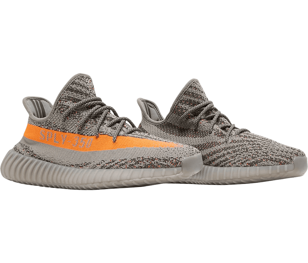 A pair of YEEZY 'Boost 350 Beluga Reflective' sneakers with full-gray cotton canvas, PK uppers, and an orange side stripe. 