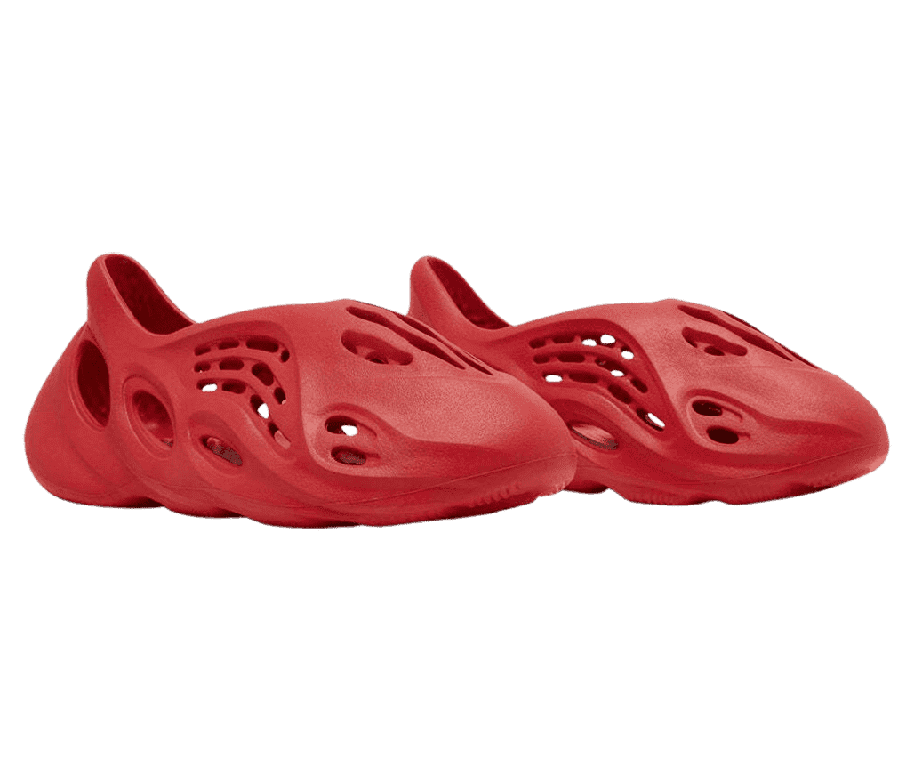A pair of YEEZY 'Foam Runners' in the color red.
                      They have a porous design and are made of a combo of algae and EVA foam.