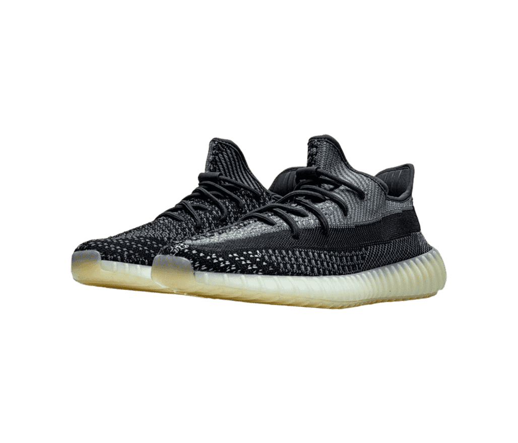 A pair of YEEZY 'Carbon' sneakers have layers of
                      black and grey colour ascending from the sole, which is semi-translucent.