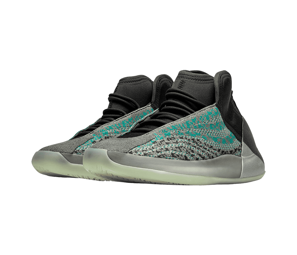 A pair of YEEZY 'Quantum' sneakers in black and gray and woven sections with teal details.