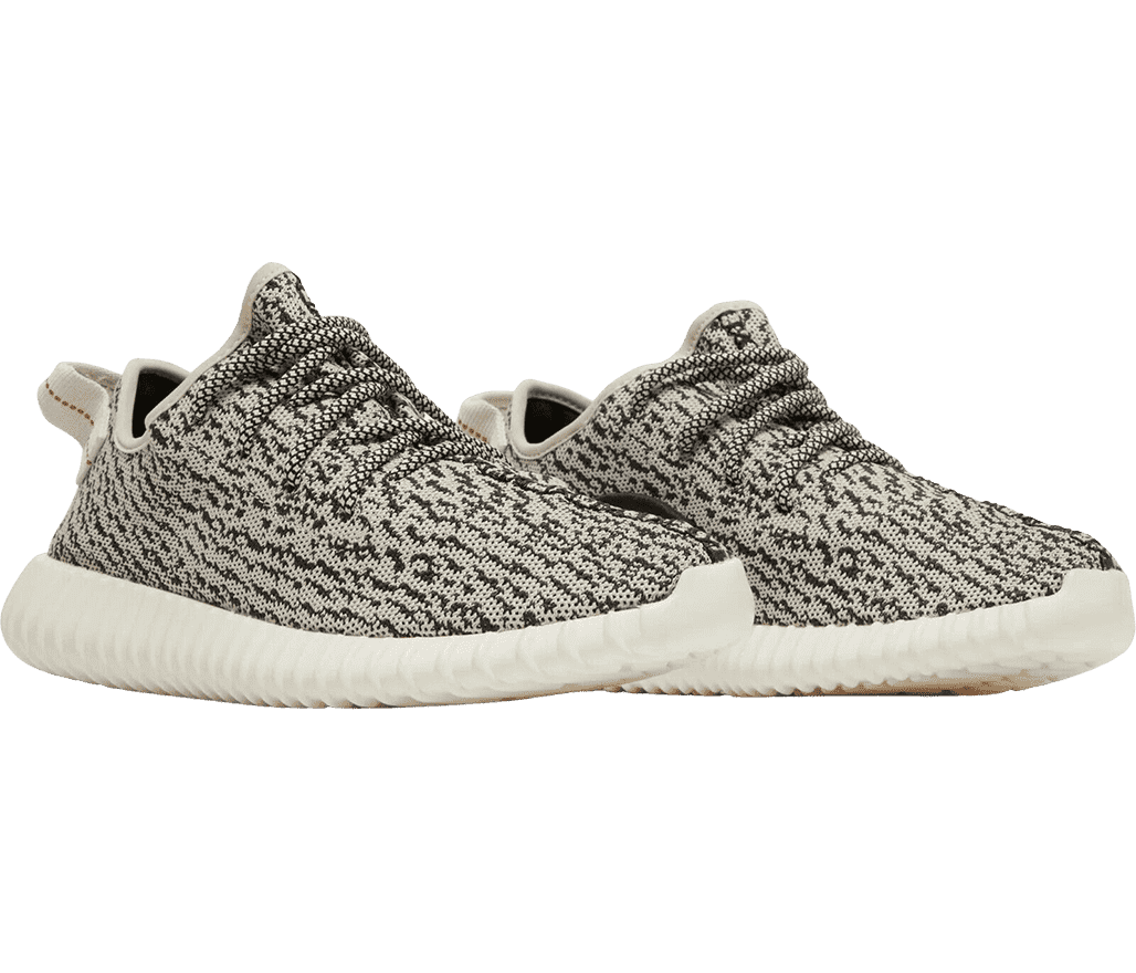 A pair of YEEZY 'Turtle Dove' sneakers with a white
                      and black texture pattern, a white pull tag, and white soles.