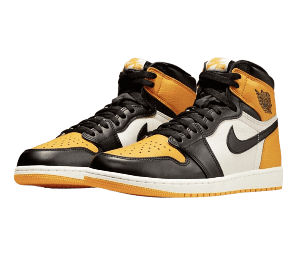 A pair of AJ1 Mid sneakers in white, black, and orange.