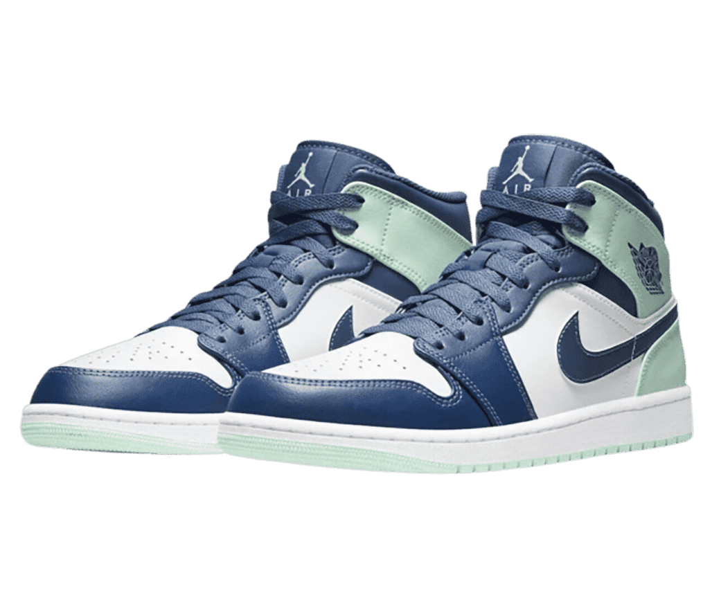 A pair of AJ1 Mid sneakers in white with navy overlays and mint collar straps and outsoles.