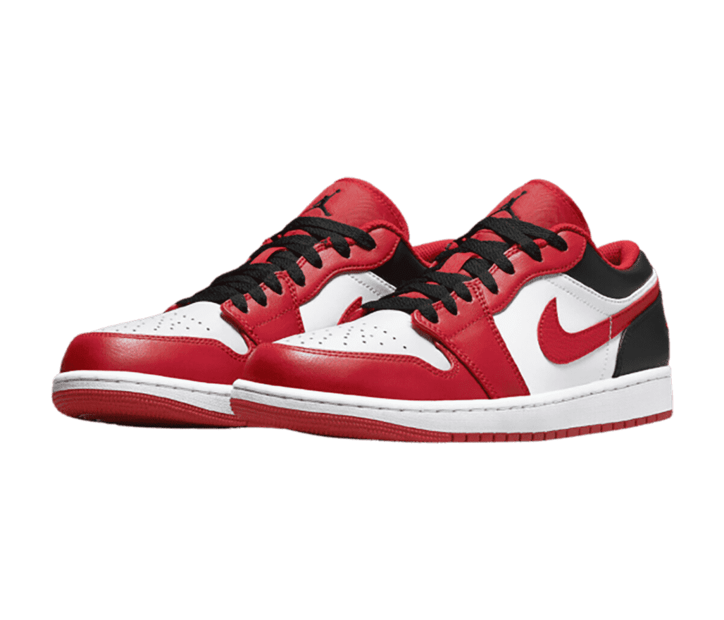 A pair of red and white AJ1 Low “Bulls” sneakers with black laces and dark gray heels and collars.