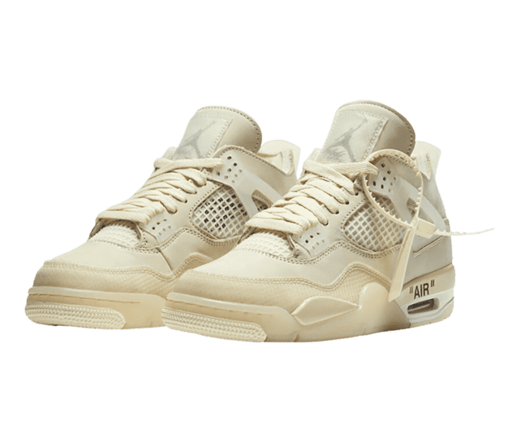 A cream pair of AJ4 Retro sneakers in suede and plastic uppers with translucent detailing and plastic zip-tie tags.
