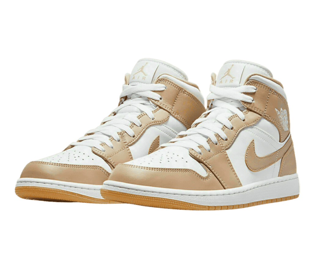 A pair of AJ1 Mid sneakers in white and beige leather, laces, and midsoles and gum outsoles.