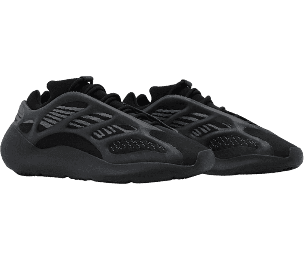 A pair of ”YEEZY 700 V3 Dark Glow” sneakers in black
                      with a patterened foam siding and boosted sole.