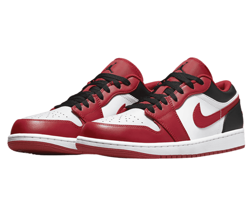 A pair of red and white AJ1 Low “Bulls” sneakers with black laces and dark gray heels and collars.