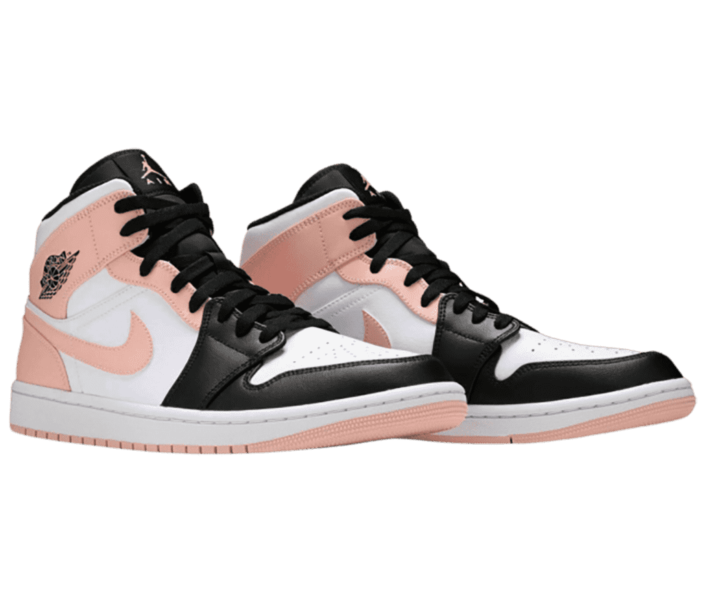 An white pair of AJ1 Mid “Crimson Tint” sneakers with black tips and tongues and salmon heels and Swooshes.
