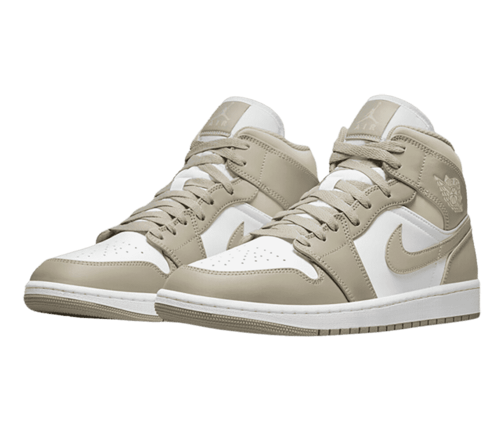 A white pair of AJ1 Mid sneakers with tan overlays and outsoles.
