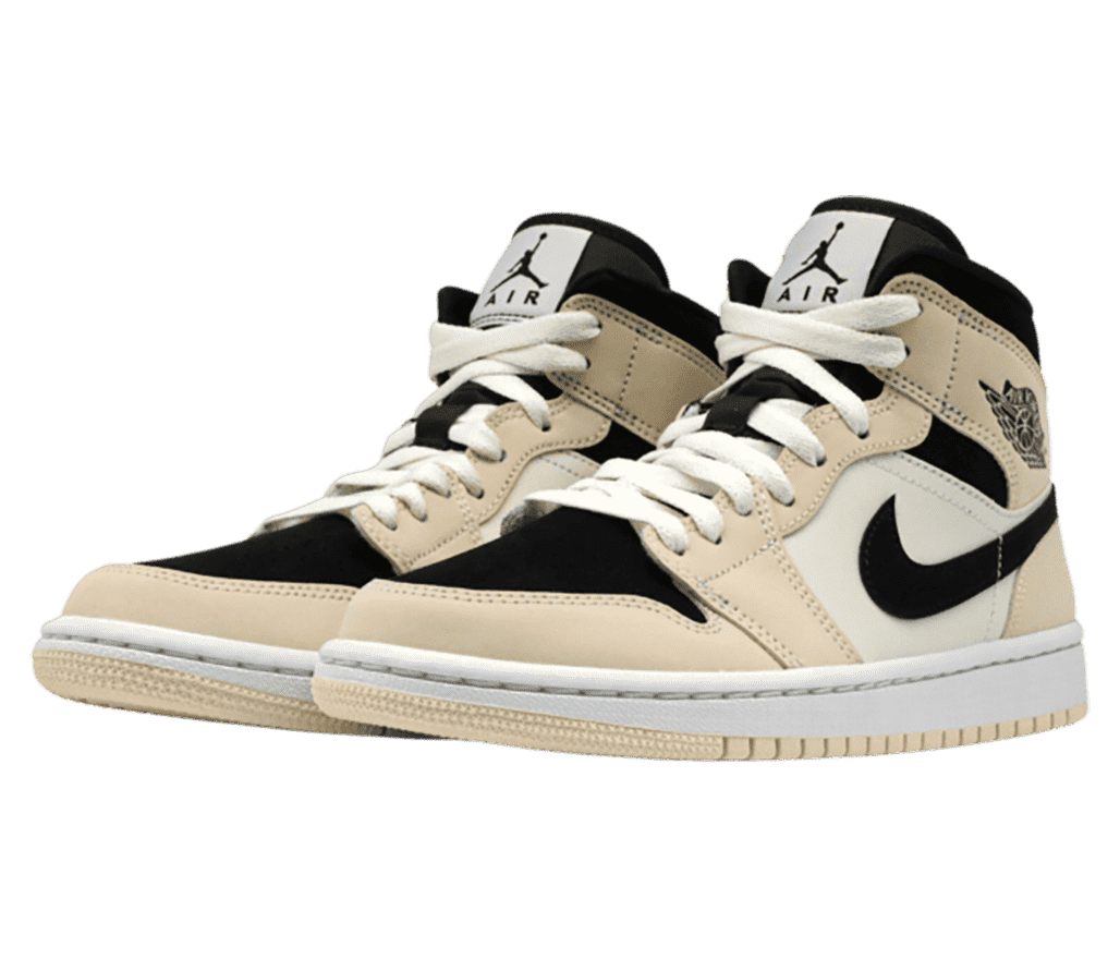 A suede pair of AJ1 Mid sneakers in two tones of beige and black toeboxes, collars, and Swooshes.