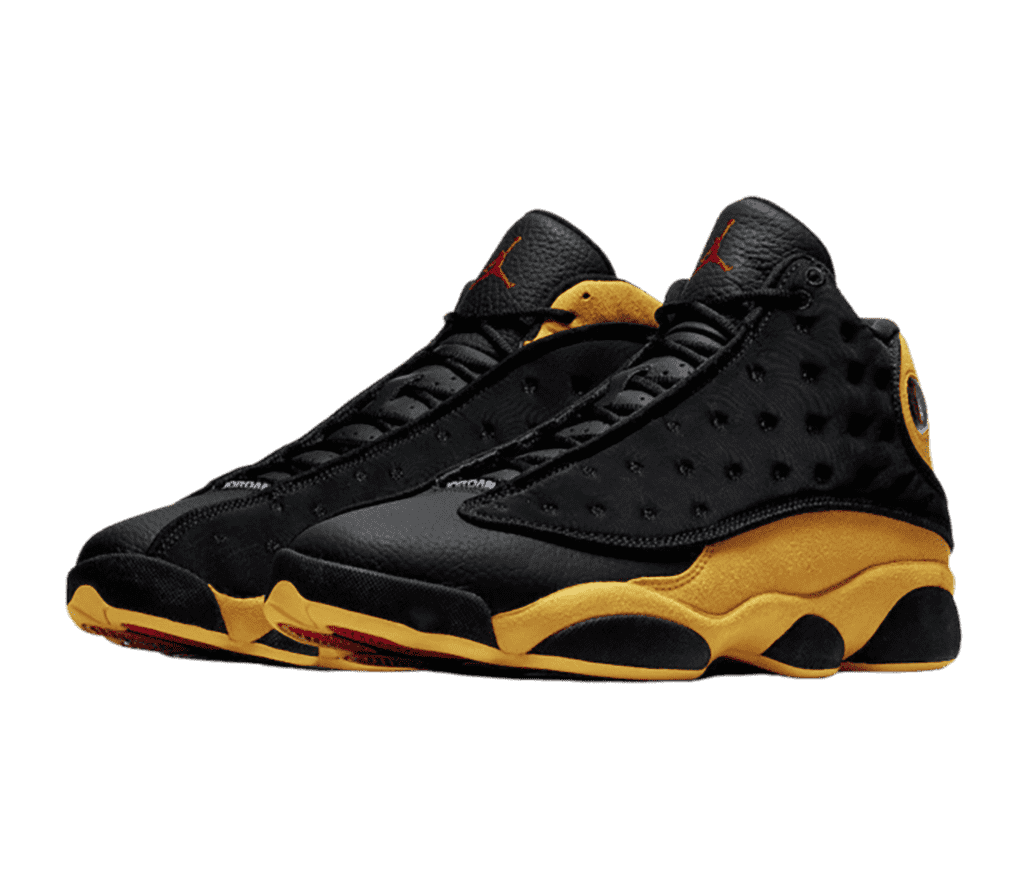 A black pair of AJ13 sneakers with golden yellow suede quarters and collars.