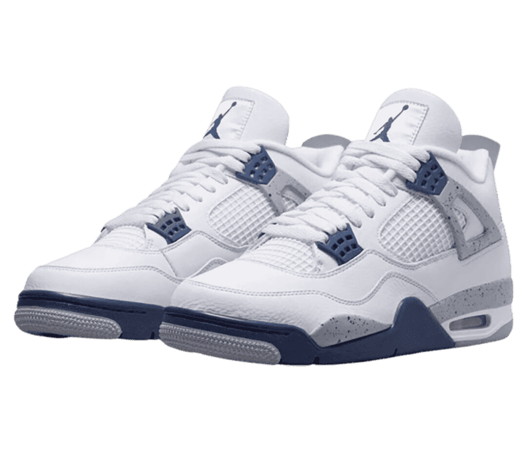 A white pair of AJ4 sneakers with navy details and speckled gray patterns on the soles and top lace cages.