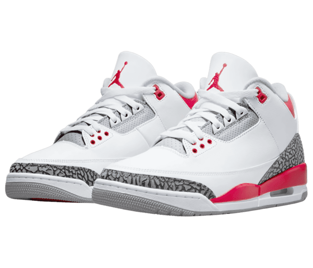 A white pair of AJ3 sneakers with red details and elephant print heels and tips.