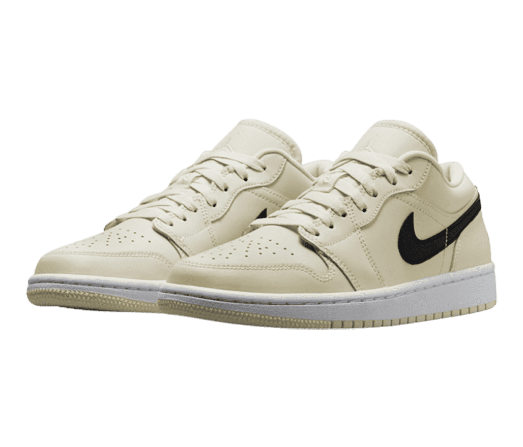 A tan pair of AJ1 Low sneakers with white midsoles and black Swooshes.