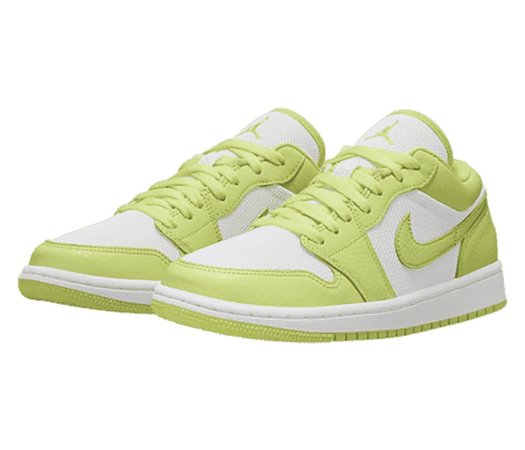 A white and lime green pair of AJ1 sneakers in leather and canvas.