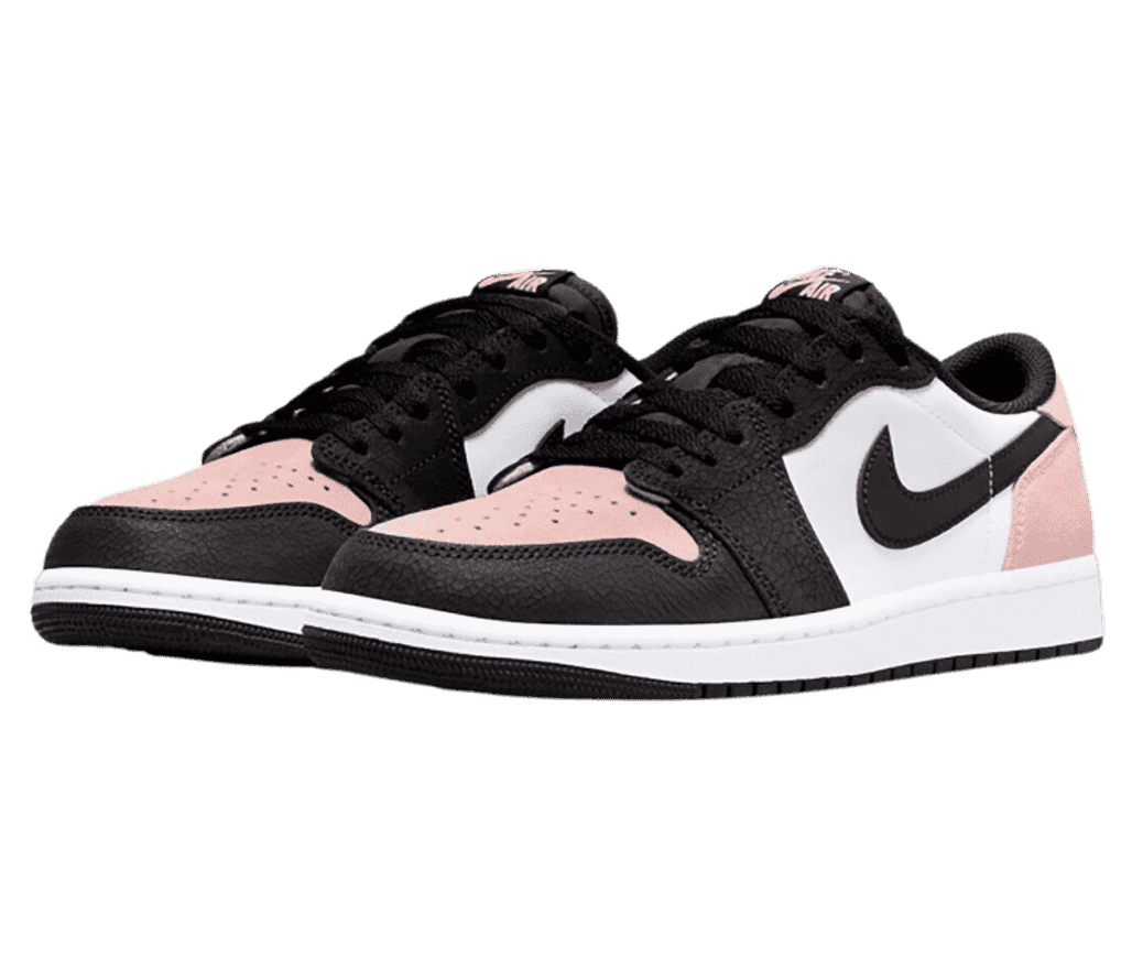 A pair of AJ1 Low sneakers with black Swooshes, cracked leather tips and vamps, pink toeboxes and heels, and white quarters.