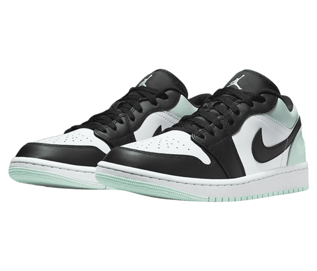 A pair of black and white AJ1 Low sneakers with mint outsoles, collars, and heels.